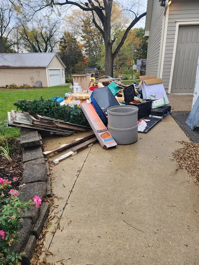 Dumpster being loaded with debris for Commercial Dumpster Rental in Dartmouth